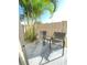 Cozy patio with seating, surrounded by lush landscaping and a privacy fence for tranquil relaxation at 4001 Beneva Rd # 319, Sarasota, FL 34233