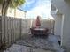 Charming outdoor patio area with brick pavers, seating, and a privacy fence, perfect for relaxation at 4001 Beneva Rd # 319, Sarasota, FL 34233