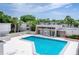 Community pool with surrounding condos and ample seating at 4001 Beneva Rd # 319, Sarasota, FL 34233