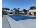 Community tennis court featuring a blue surface, a net, and palms at 4001 Beneva Rd # 319, Sarasota, FL 34233