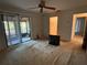 Bedroom with sliding glass doors to the enclosed porch, and adjacent closet at 4199 66Th Street W Cir # 4199, Bradenton, FL 34209