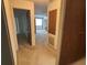 Hallway offering access to various rooms and providing ample space, leading to different areas of the home at 4199 66Th Street W Cir # 4199, Bradenton, FL 34209