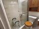 Accessible shower with safety features including a shower chair and multiple shower caddies at 4199 66Th Street W Cir # 4199, Bradenton, FL 34209