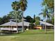 Golf course clubhouse with expansive views of the well-manicured golf course and blue skies at 4440 Fairways Blvd # 310, Bradenton, FL 34209