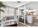 Bright and airy living area with sliding glass doors and view into the kitchen at 4440 Fairways Blvd # 310, Bradenton, FL 34209