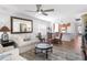 An open-plan living area connects to the kitchen, features neutral decor, and lots of natural light at 4440 Fairways Blvd # 310, Bradenton, FL 34209
