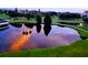 Scenic water view with reflections of trees and sky, showcasing the tranquil and picturesque setting of the property at 4440 Fairways Blvd # 310, Bradenton, FL 34209
