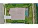 Aerial view of a home with a screened-in pool, well-maintained lawn, and neutral-colored roof at 4531 Useppa Dr, Bradenton, FL 34203