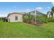 Well-maintained yard highlighting the home's air conditioning unit at 4531 Useppa Dr, Bradenton, FL 34203