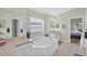 This spacious bathroom offers a soaking tub beneath a window for natural light at 4531 Useppa Dr, Bradenton, FL 34203
