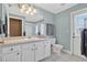 Bathroom featuring a spacious vanity, toilet, and access to the outdoors at 4531 Useppa Dr, Bradenton, FL 34203