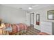 Well-lit bedroom offers twin beds, a closet, a dresser, and wood-look flooring at 4531 Useppa Dr, Bradenton, FL 34203