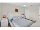 Bright bedroom featuring a modern white bed set and a ceiling fan at 4531 Useppa Dr, Bradenton, FL 34203