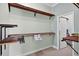 Walk-in closet with wood shelves for storage and plenty of room to organize items at 4531 Useppa Dr, Bradenton, FL 34203