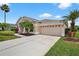 Beautiful single-story home with a large garage and well-maintained front yard landscaping at 4531 Useppa Dr, Bradenton, FL 34203