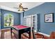 Game room with a pool table, blue walls, and hardwood floors at 4531 Useppa Dr, Bradenton, FL 34203