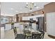 Bright eat-in kitchen boasts stainless steel appliances, white cabinets, and a cozy breakfast nook at 4531 Useppa Dr, Bradenton, FL 34203