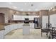 Well-lit kitchen featuring white cabinets, granite countertops, stainless steel appliances, and center island at 4531 Useppa Dr, Bradenton, FL 34203