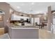 Well-lit kitchen featuring granite countertops, stainless steel appliances, and white cabinetry at 4531 Useppa Dr, Bradenton, FL 34203