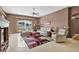 Spacious living room with plenty of natural light, comfortable seating, and a ceiling fan at 4531 Useppa Dr, Bradenton, FL 34203