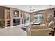 Inviting living room with fireplace, built-in shelving, and sliding glass doors to the outdoor patio at 4531 Useppa Dr, Bradenton, FL 34203
