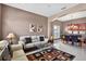 Cozy living room with neutral decor, ample natural light, and adjacent dining area at 4531 Useppa Dr, Bradenton, FL 34203