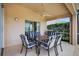 Covered patio features an outdoor kitchen, a ceiling fan and dining table with seating at 4531 Useppa Dr, Bradenton, FL 34203