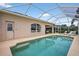 A view of the lovely sparkling pool and patio area, ideal for relaxing and entertaining at 4531 Useppa Dr, Bradenton, FL 34203