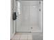 Enclosed tiled shower with sliding glass doors and chrome fixtures at 4531 Useppa Dr, Bradenton, FL 34203