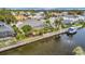 Beautiful aerial view of waterfront homes with private docks, screened lanais, and lush landscaping at 4727 Starboard Dr, Bradenton, FL 34208