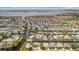 An aerial view of a waterfront community with many homes, canals, and access to a larger bay at 4727 Starboard Dr, Bradenton, FL 34208