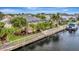Tranquil backyard featuring a screen enclosed pool and access to the waterway at 4727 Starboard Dr, Bradenton, FL 34208
