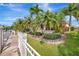 Stunning waterfront home with lush landscaping, seawall, and picturesque canal views at 4727 Starboard Dr, Bradenton, FL 34208