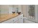 Bathroom featuring granite countertop vanity with vessel sinks and access to the lanai and pool at 4727 Starboard Dr, Bradenton, FL 34208