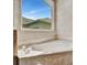 Bathtub with decorative faucets and a view of the home's exterior at 4727 Starboard Dr, Bradenton, FL 34208