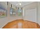 Bright bedroom features wood floors, natural light from bay windows, and a spacious closet for ample storage at 4727 Starboard Dr, Bradenton, FL 34208