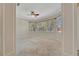 Spacious bedroom with neutral carpeting, a ceiling fan, and large windows allowing natural light at 4727 Starboard Dr, Bradenton, FL 34208