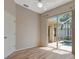 Bedroom featuring laminate wood flooring, ceiling fan, and glass sliding doors to lanai and pool at 4727 Starboard Dr, Bradenton, FL 34208
