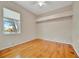 Bedroom with hardwood floors, neutral paint and trim, ceiling fan and a window with a view at 4727 Starboard Dr, Bradenton, FL 34208