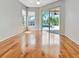 Bright bedroom featuring wood floors, a sliding glass door to the pool area, and ample natural light at 4727 Starboard Dr, Bradenton, FL 34208