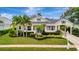 Charming single-Gathering home with beautiful landscaping, mature palms and a carport at 4727 Starboard Dr, Bradenton, FL 34208