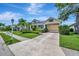 Charming single-story home with well-maintained landscaping, driveway, and attached carport at 4727 Starboard Dr, Bradenton, FL 34208