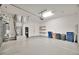 Spacious garage with epoxy flooring, ample storage, and modern utilities neatly arranged for functionality at 4727 Starboard Dr, Bradenton, FL 34208