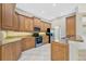 Kitchen featuring stainless appliances, granite countertops and wooden cabinets at 4727 Starboard Dr, Bradenton, FL 34208