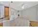 Bright living room boasts neutral walls, tile flooring, and a ceiling fan at 4727 Starboard Dr, Bradenton, FL 34208