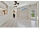 Open-concept living room with tiled floors and neutral wall color with natural light at 4727 Starboard Dr, Bradenton, FL 34208