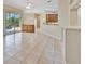 Open living space with tile floors, sliding glass doors to pool and wooden cabinets at 4727 Starboard Dr, Bradenton, FL 34208