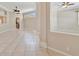Spacious living room with tile flooring, elegant columns, and multiple ceiling fans for comfort at 4727 Starboard Dr, Bradenton, FL 34208