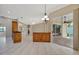 Open living room featuring tile floors and view of the pool and lanai through sliding glass doors at 4727 Starboard Dr, Bradenton, FL 34208