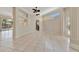 Bright living area featuring tile floors, an open layout, and views of the pool area at 4727 Starboard Dr, Bradenton, FL 34208